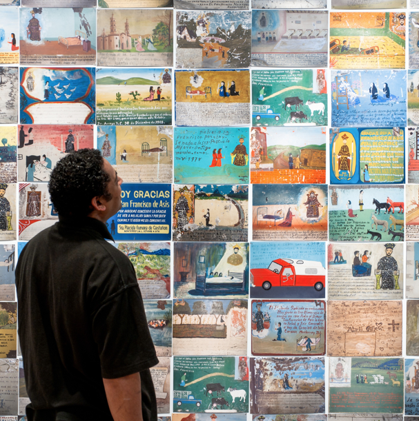Installation view of the 2011-12 Wellcome Collection exhibition 'Infinitas Gracias: Mexican Miracle Paintings'. Image: Wellcome Collection.